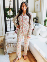 Get cozy in timeless holiday style with our Menโs and Womenโs Holly Jolly Reindeer print. Designed for comfort and classic charm, this two-piece set features a button-down long sleeve top and relaxed-fit pants in a festive pattern that includes bows, reindeer, mistletoes and more. Made from ultra-soft, breathable fabric, itโs perfect for lounging, sleeping, or matching family Christmas mornings.